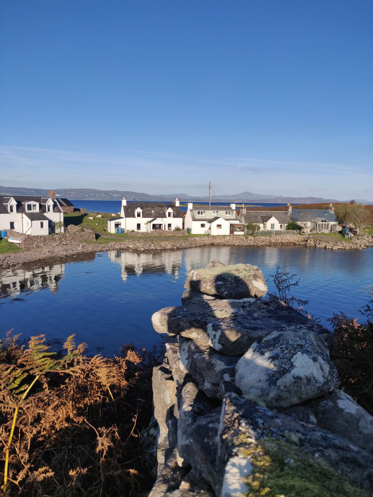 Cottages reflected in the bay